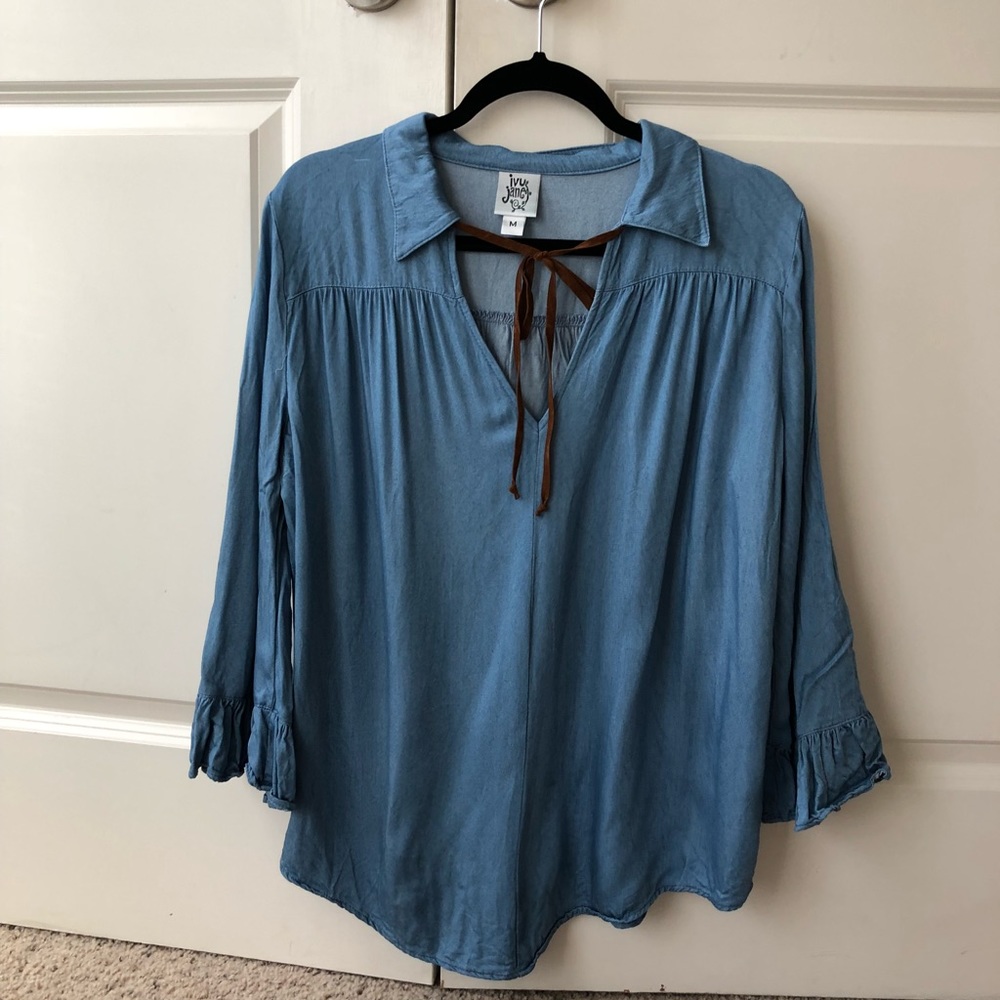 Blue top with brown tie